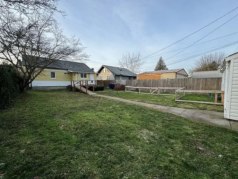 Large backyard with spacious deck and ramp