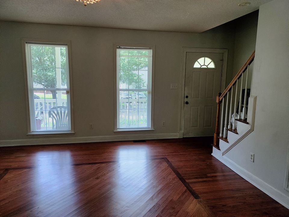 Living room. It has log fireplace.
