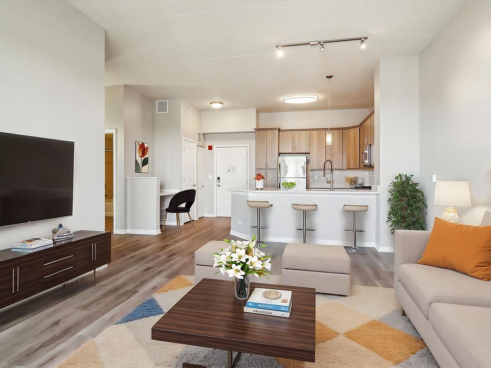 Open-concept living with breakfast bar seating