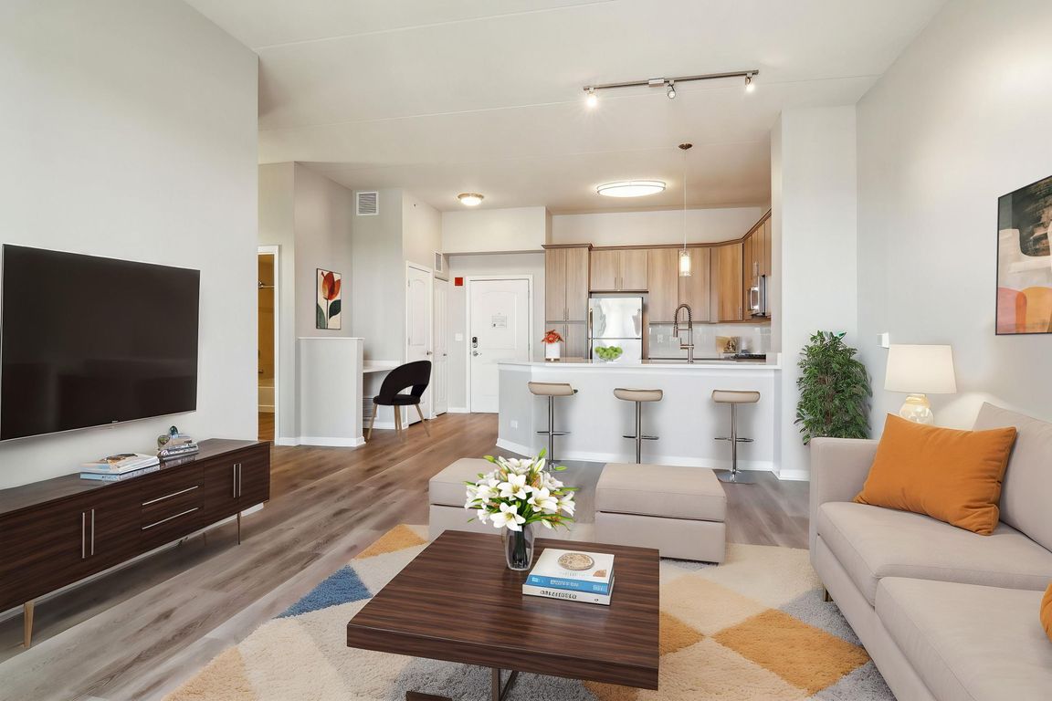 Open-concept living with breakfast bar seating