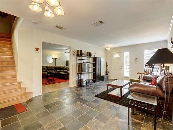 This is another view of the living room and one of the dining areas.  The light fixtures have also been updated.