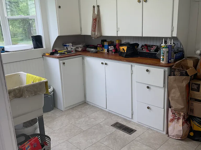 Laundry room with bay window, tub sink and extra cabinet storage 
Washer/Dryer included, not installed yet