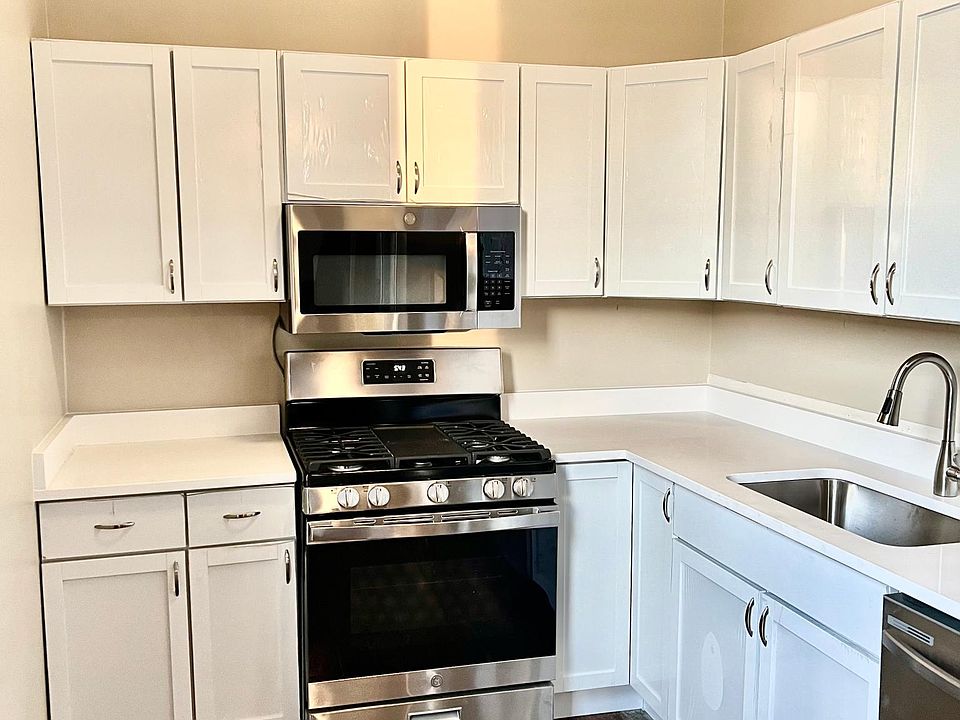 Renovated kitchen featuring new stainless steel appliances