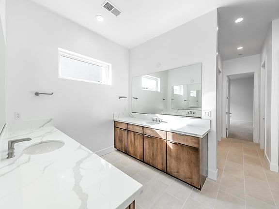 Primary bathroom with large walk-in shower and walk-in closet