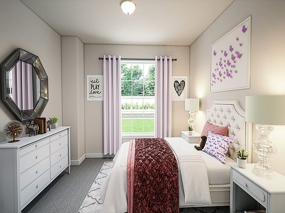 A cozy and well-decorated bedroom with a large window, a tufted headboard, and various decorative el