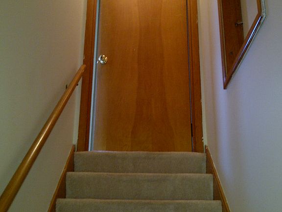 Top of Stairs - Into apartment and Storage entry on right above main house...quite a bit of space available to store