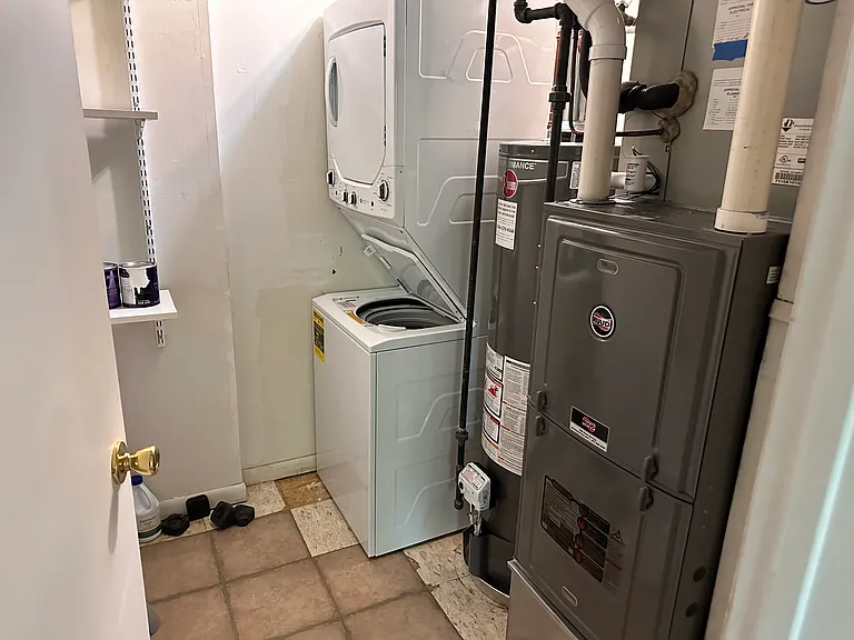 Utility room with brand new washer & dryer, water heater, and high efficiency heater & AC.