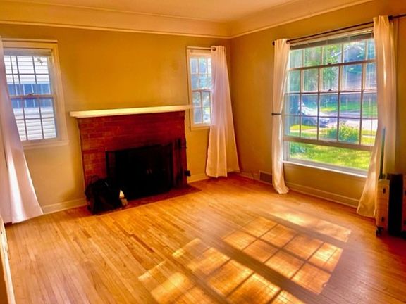 Living Room with Fireplace and and Large Bay Window