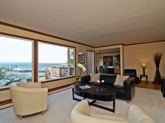 Living room with picturesque views of sound and Olympic Mountains