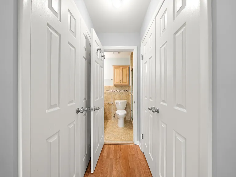 Primary Bedroom - double closets and Primary Bath view