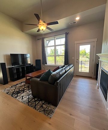 Leather sofa, high-quality speaker system, and a fireplace