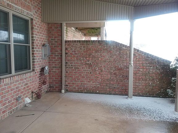 Covered back patio with ceiling fan