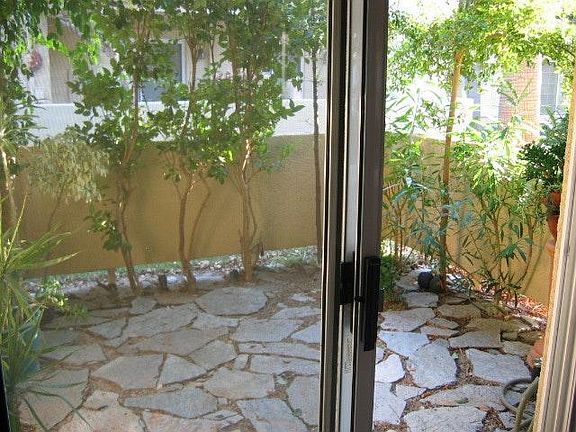View of private patio garden from dining area