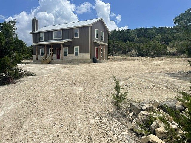 Two story house of 2271 square feet, four bedrooms on 5 acres south of Blanco.