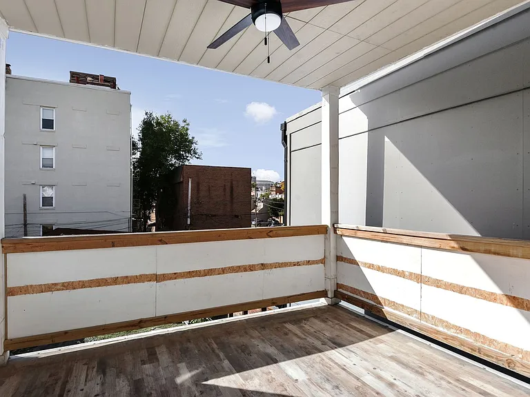rear private deck with backyard and alley overlook