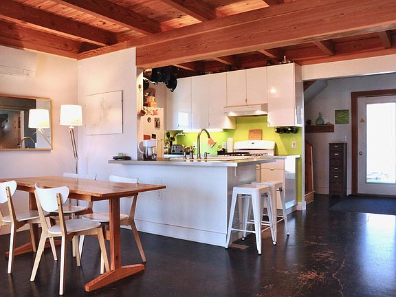 Open floor plan with wood beams