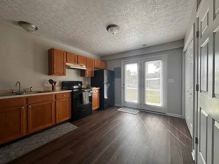 Kitchen / Dining room - Updated plank flooring and freshly painted.