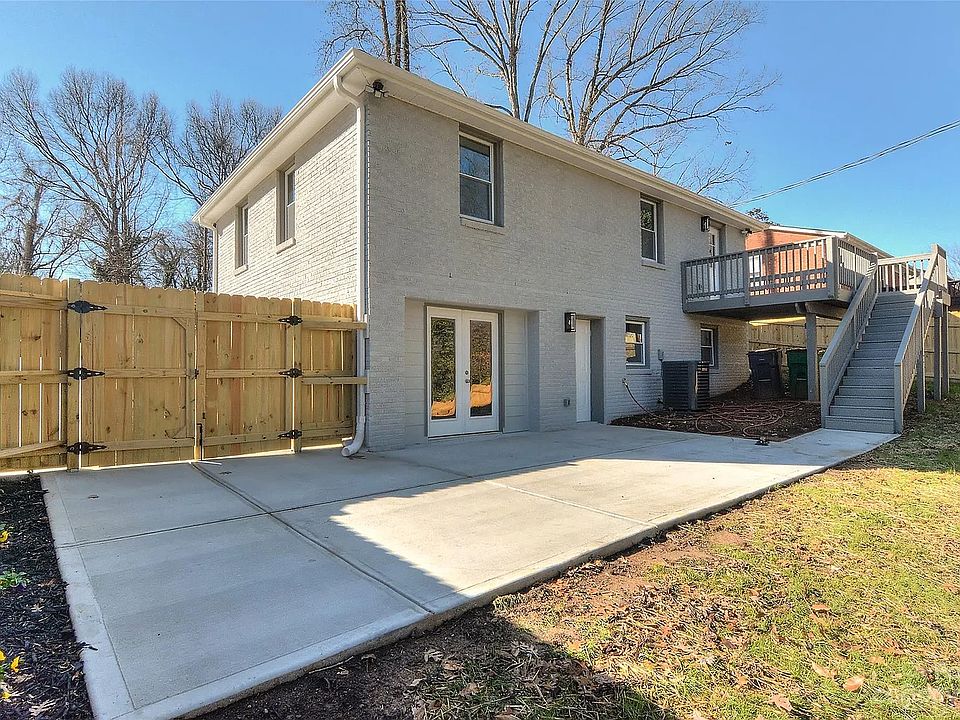 Backyard entrance from fence, apartment entrance, patio area
