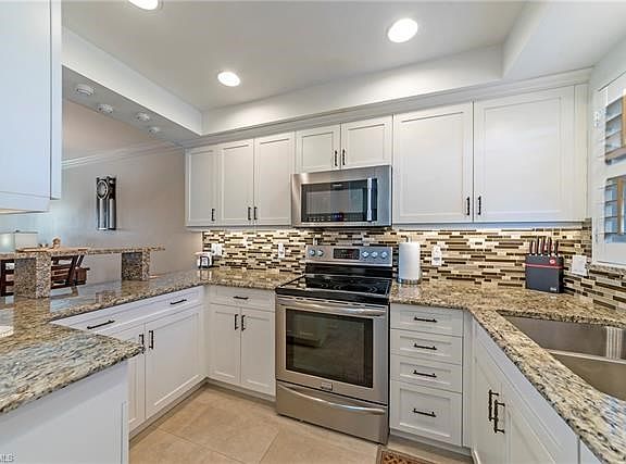 Raised ceiling, added lighting, new electrical panel, crown molding and so many more special touches were added to create this m