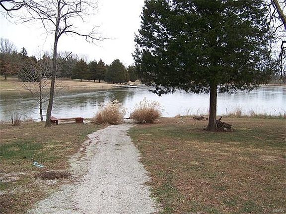 Beautiful 15 ac lake. Walk down the path from your deck straight to your lake where you can fish, boat or just relax.