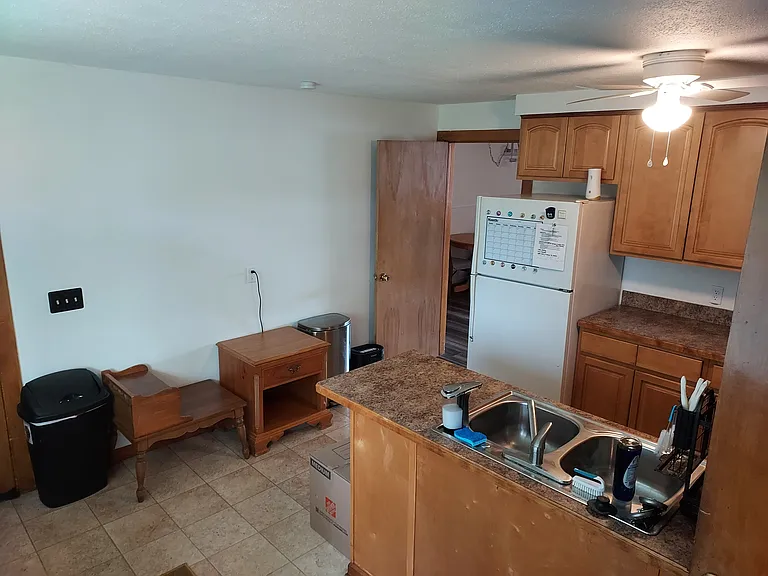 Kitchen with the BONUS large office off the back. Also, large windows throughout the office and kitchen bring in TONS of natural light and look out onto the private backyard.