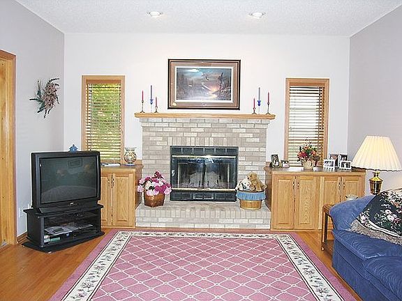 Oak hardwood floors and woodburning Fireplace in family room