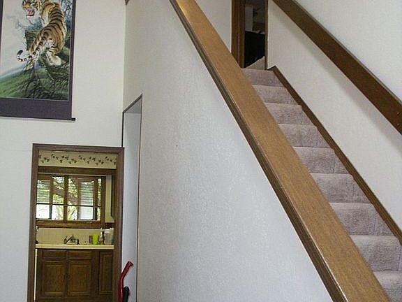 Vaulted entrance, stairs leading to master bedroom