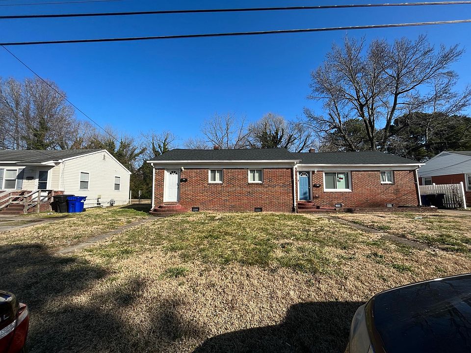 Front of Property. Unit is on left with white front door.
