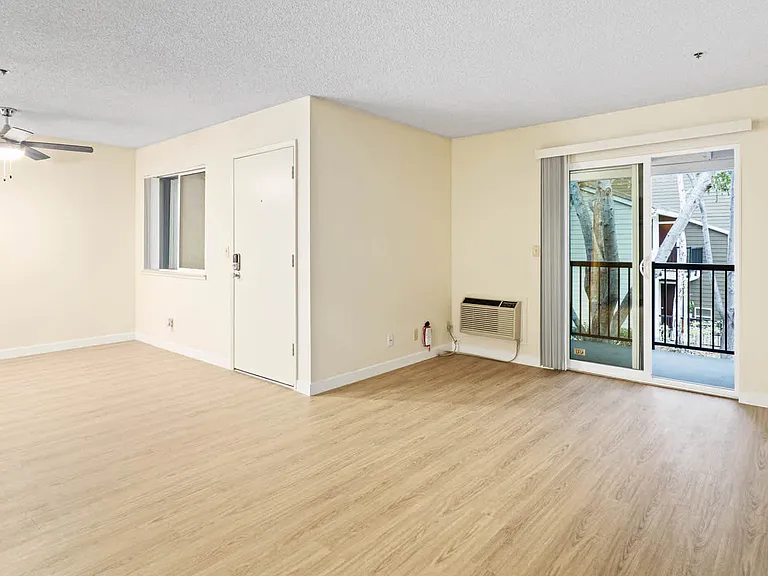 Living Room with Balcony and Hard Surface Flooring
