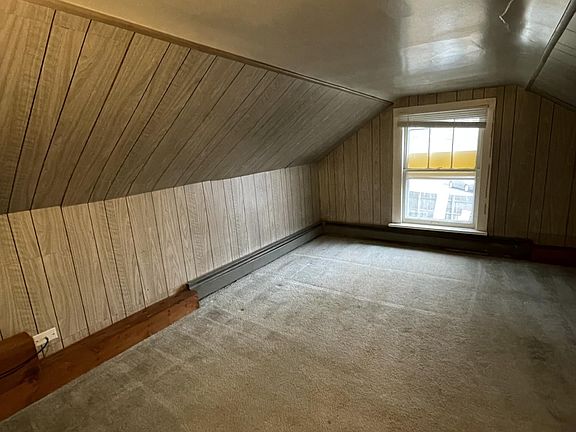 Bonus room is carpeted and has natural light.