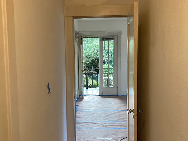Hallway, between bathroom and two bedrooms,
to the living room and kitchen.