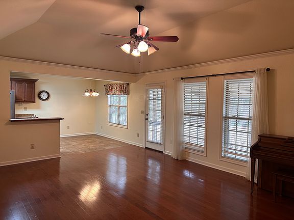 Open living area with hardwood floors.
