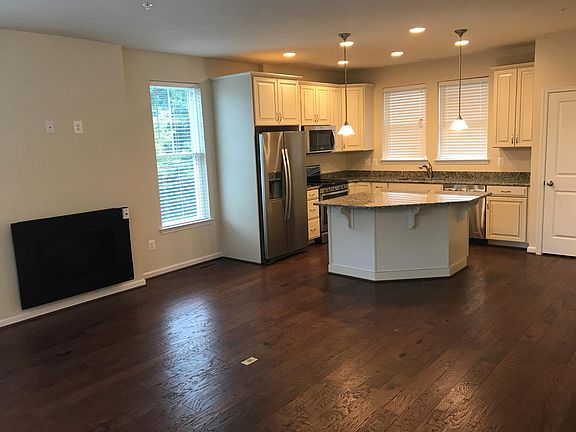 Large kitchen and living room with fire place.