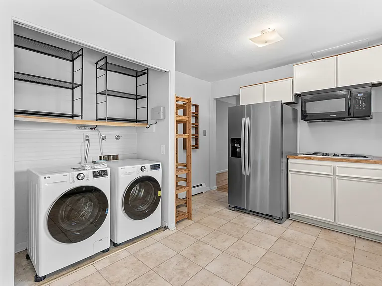 In-unit washer and dryer makes everyday laundry convenient, with even more shelving for storage.