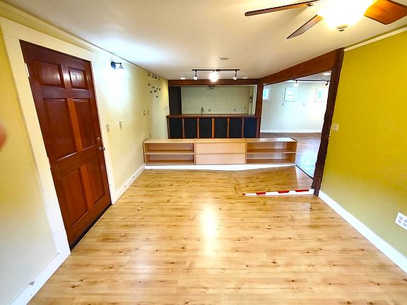 Entryway storage open to custom bar area.