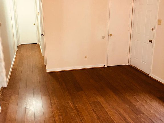Hardwood floors runs throughout the hallway.