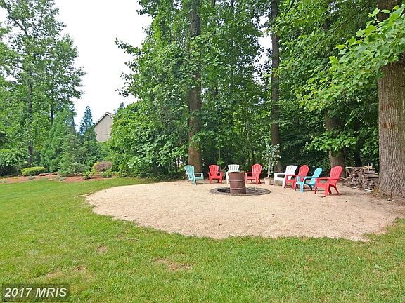 Fire Pit tucked away in corner of rear yard