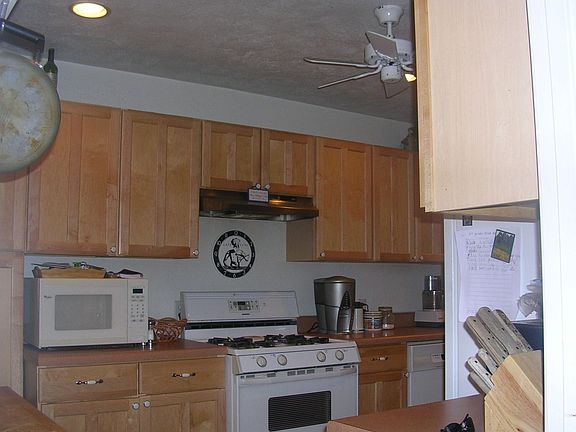 Updated Kitchen complete with upgraded cabinets and ceramic tile flooring.