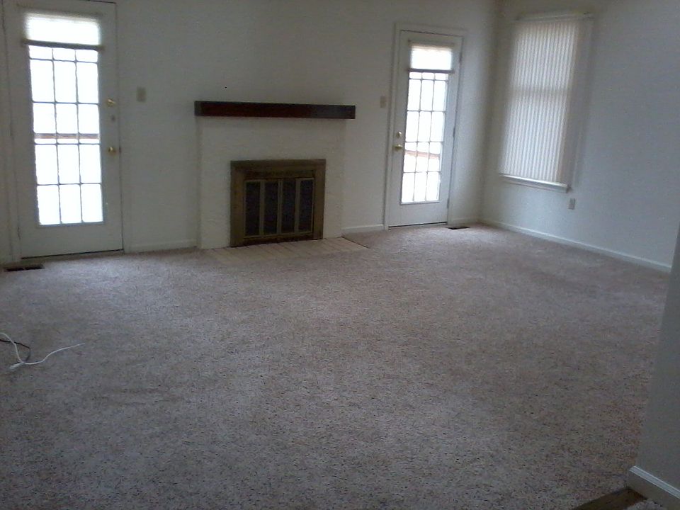 Liv room wall has windows since it is the end unit