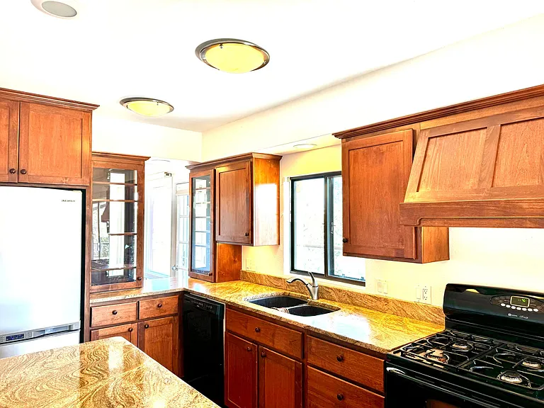 Upgraded kitchen. Slide out drawers, spice panty, undercounter lighting, breakfast bar. Gorgeous view from kitchen sink.