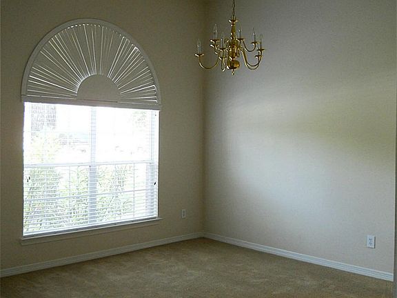 Dining room with large window.