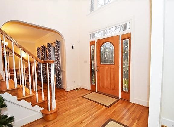 2-Story Foyer, Arched Entries to the Formal Rooms, Beautiful Front Door & Hardwood Floors!