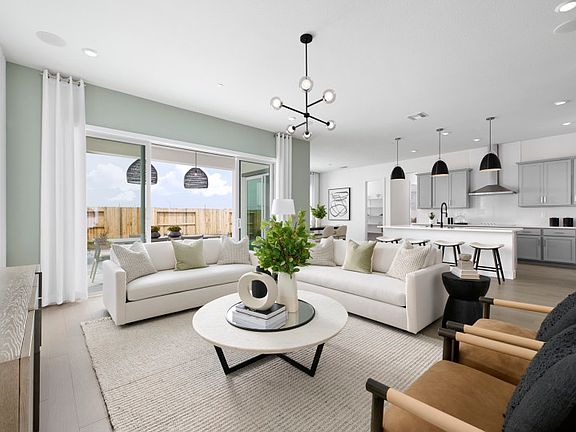 Gathering room leading into kitchen area