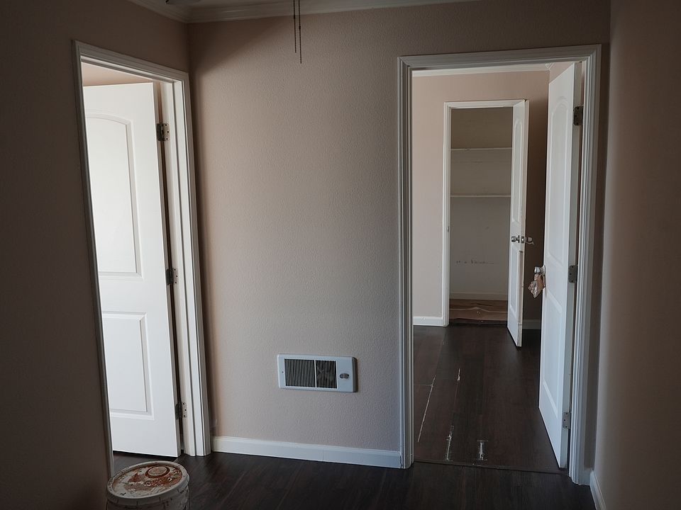 View from the living room. On the left is the smaller bedroom. Straight ahead leads to Master Bedroom