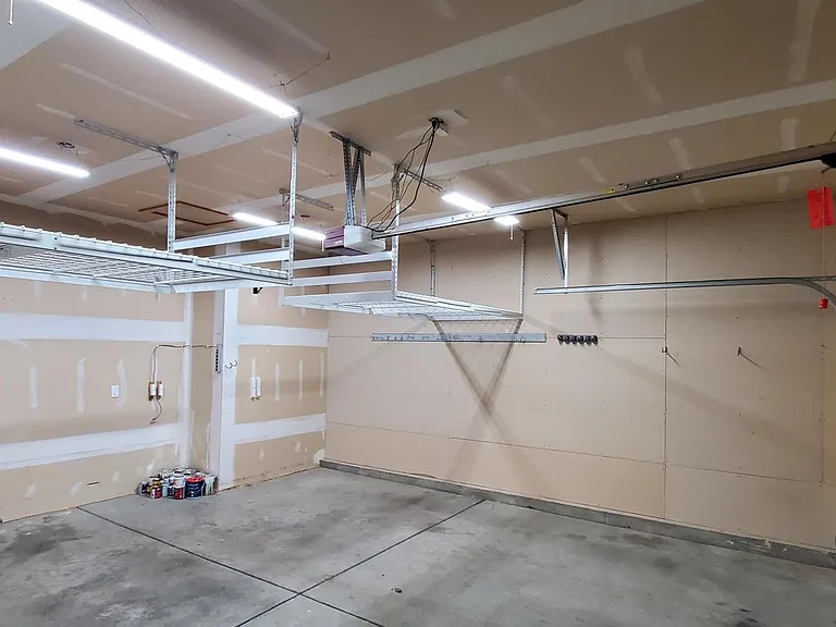Garage with overhead storage, automatic garage door opener