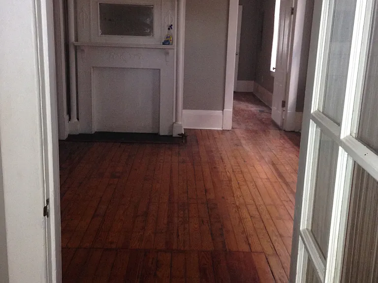French door leading from living room to dining room. Door at fireplace leads to kitchen.