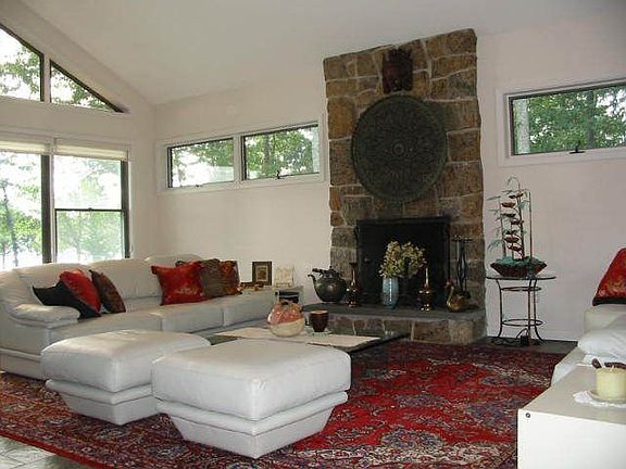 Livingroom with fieldstone fireplace
