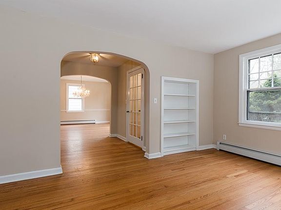 Living room off of foyer. Built-in bookshelf