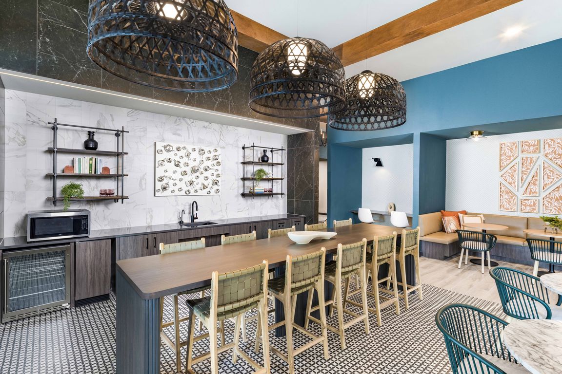 Discover the heart of community living at Modera Georgetown's expansive clubroom, complete with a cozy coffee bar.