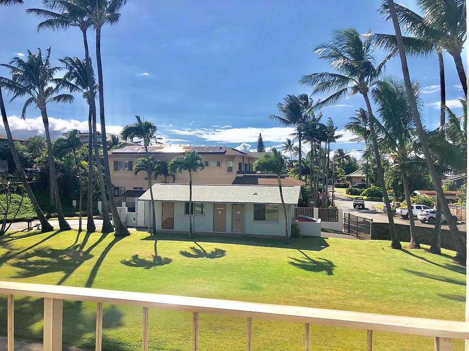 Lanai views expansive lawn. Left door on building is access to coin operated washer dryers
Right side of building has trash area, pedestrian gate has code to walk to Mamas sandy beach